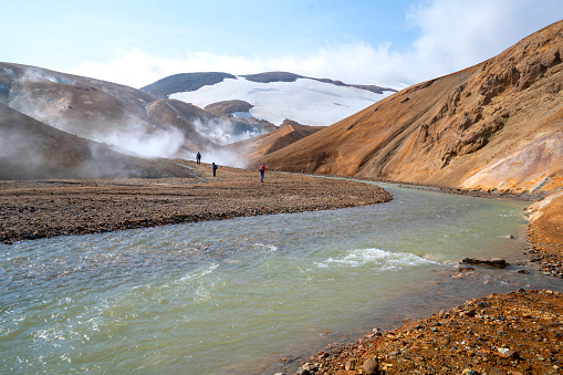 Detail from beautiful landscape of Kerlingarfjöll  mountain range featuring geothermal springs at Hveradalir geothermal area. Beautiful colors, hot springs and tourists.