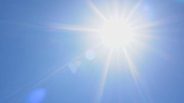 istock Direct ray of the sun in the blue sky 1335818577