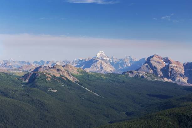 Mount Assiniboine, Canadian Rocky Mountains Mount Assiniboine, High Mountain Peak in Canadian Rockies with Blue Sky Horizon and Aerial Landscape View of Forest Valley. Summertime Hiking in Alberta Banff National Park rocky mountains banff alberta mountain stock pictures, royalty-free photos & images