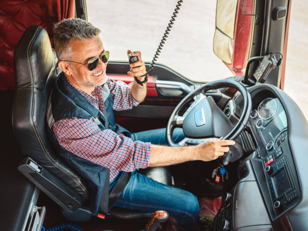 istock Mature truck driver CB talking 1335819957
