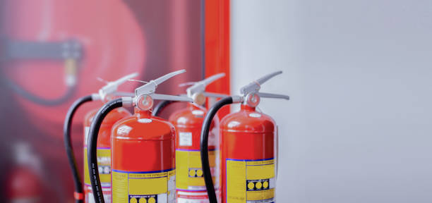 istock The red fire extinguisher is ready for use in case of an indoor fire emergency. 1335820788