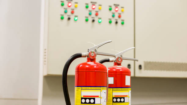 istock The red fire extinguisher is ready for use in case of an indoor fire emergency. 1335820869