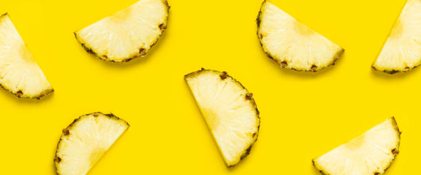 istock Pineapple slice against on a yellow background. Top view, flat lay. Banner 1335820873