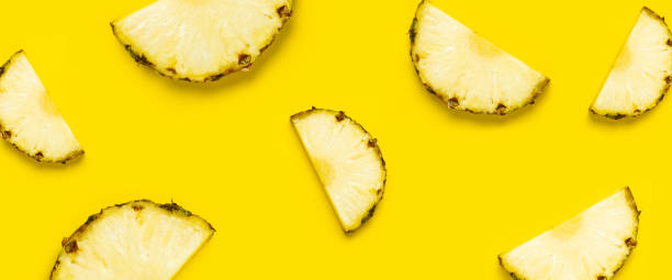 istock Pineapple slice against on a yellow background. Top view, flat lay. Banner 1335820884