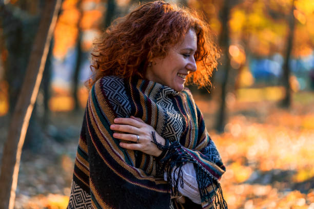 istock eautiful woman enjoying in a sunny autumn day 1335822385