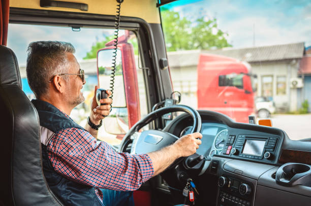 Mature truck driver CB talking stock photo