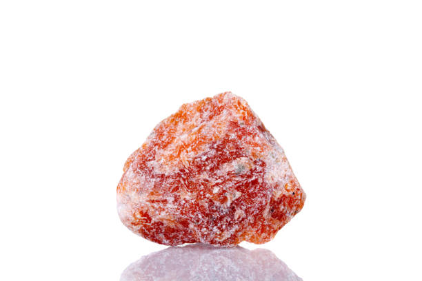 macro mineral stone orange calcite on a white background macro mineral stone orange calcite on a white background close-up calcite stock pictures, royalty-free photos & images