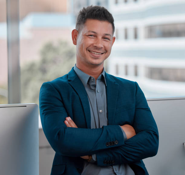 istock Shot of a young man standing in a modern office 1335824031