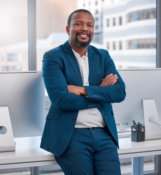 istock Shot of a young man standing in a modern office 1335824032
