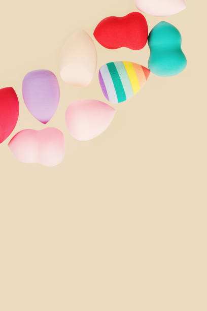 Colorful cosmetic beauty sponges different form Red, pink, rainbow colored makeup tools