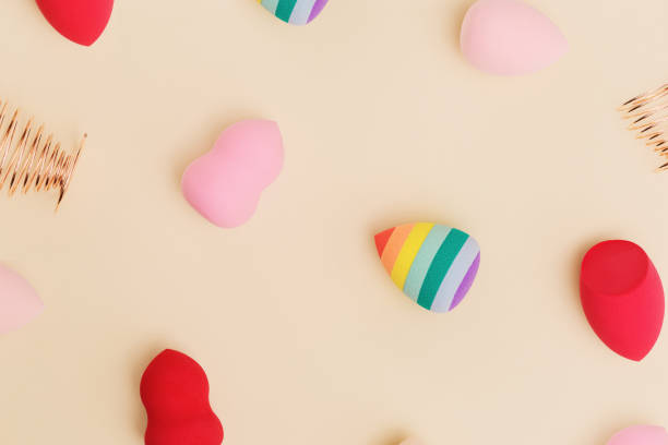 istock Flat lay colorful cosmetic beauty sponges close up different form. Makeup tool for applying products 1335824285