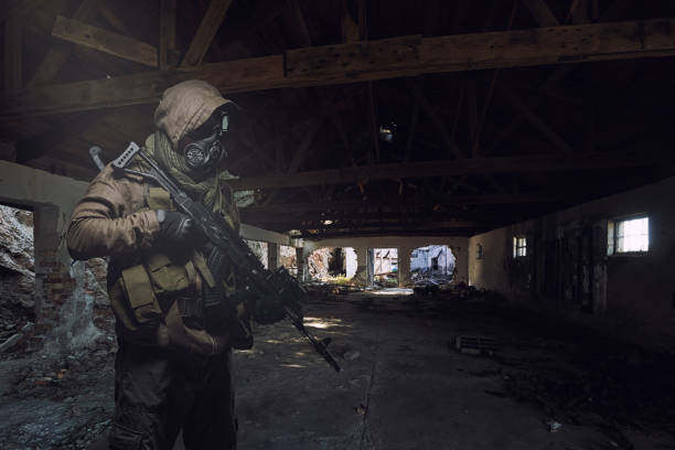 istock man in gas mask wandering through abandoned settlement. 1335836524
