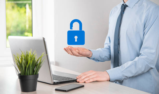 istock Male hand holding a lock padlock icon.Cyber security network. Internet technology networking.Protecting data personal information on tablet. Data protection privacy concept. GDPR. EU.Banner 1335838025