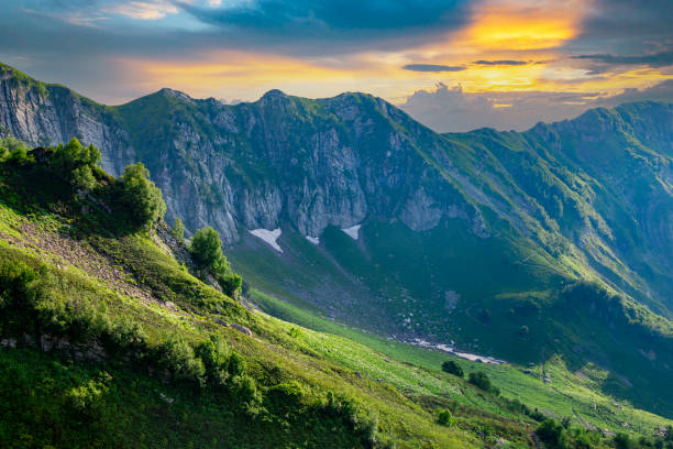 istock Beautiful sunset in a green mountain valley, background with nature 1335839934