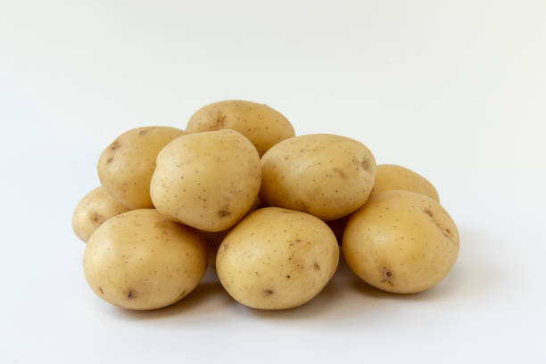 istock pile of potatoes isolated on white background 1335840173