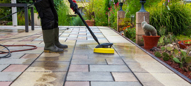 istock Cleaning stone slabs on patio with the high-pressure cleaner. 1335840251