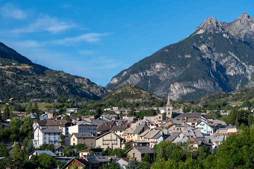 Picturesque village of Guillestre in the Hautes-Alpes department in summer surrounded by mountains