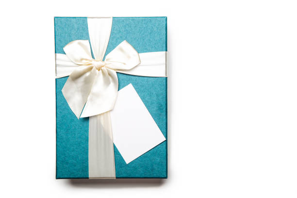 istock Gift box with empty white blank gift tag mock up. Christmas, birthday or wedding gift. Isolated background 1335844908