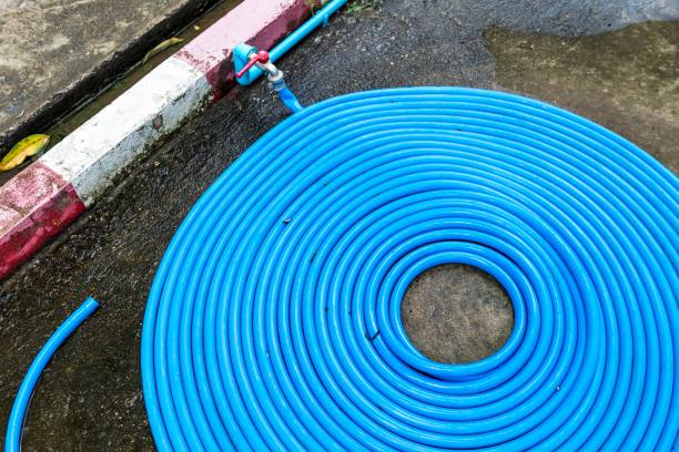 istock Blue plastic water pipe arrange in round shape on old cement floor 1335853337