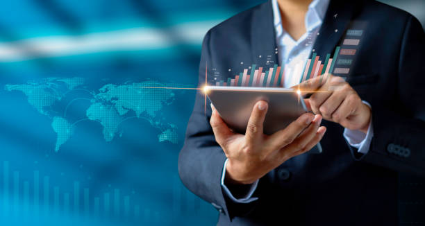 istock Businessman holding tablet with showing a growing hologram 1335853479