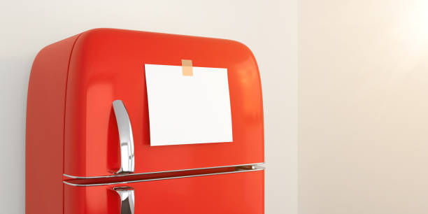 istock blank memo note sticker on red refrigerator close up. blank paper reminder on red retro fridge door close up mockup 1335853553