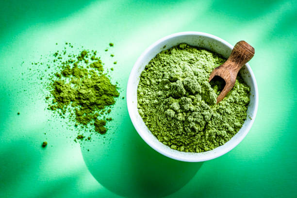 istock Moringa oleifera powder on green background 1335854889