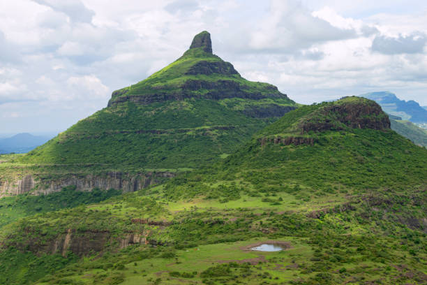View of Ikhara peak popular with rock climbers from the Dhodap fort, Nashik, Maharashtra, India. View of Ikhara peak popular with rock climbers from the Dhodap fort, Nashik, Maharashtra, India. maharashtra stock pictures, royalty-free photos & images