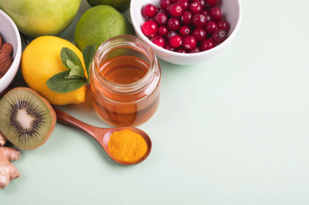 istock Healthy food for immunity boosting on green background. 1335855915