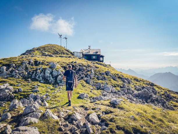 istock Mountaineer hiking on summer early morning 1335855942