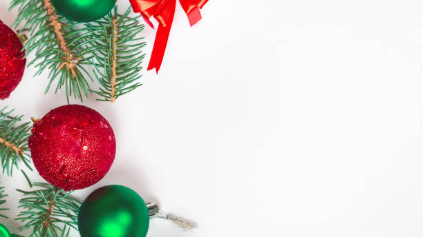 istock Christmas composition. Gifts, spruce branches, red decorations on a white background. Christmas, winter, new year concept. copy space 1335860373