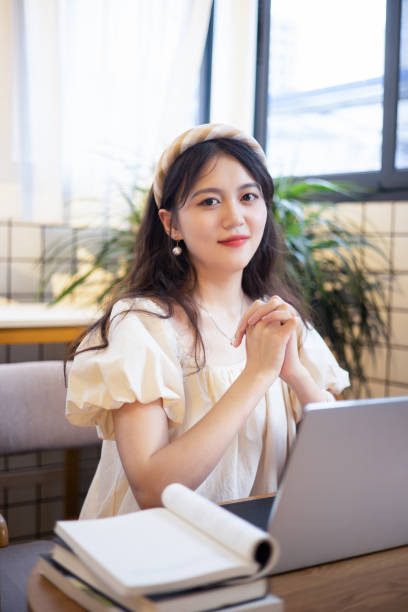 istock Asian young student portrait at cafe 1335861115