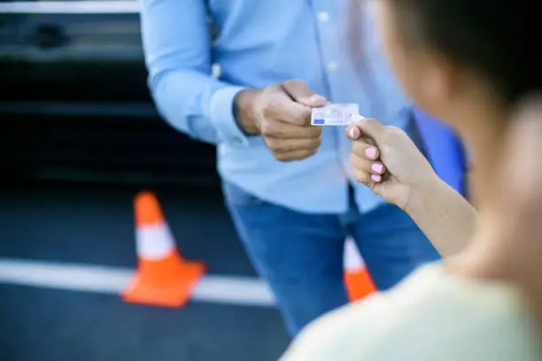 Photo of Driving student receiving her licence