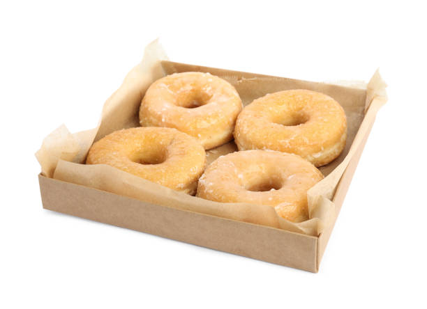 istock Delicious donuts in box isolated on white 1335868152