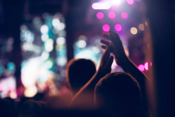 istock De-focused concert stage with laser lights and beams. 1335868282