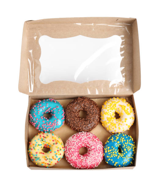 istock Tasty glazed donuts in cardboard box isolated on white, top view 1335868341