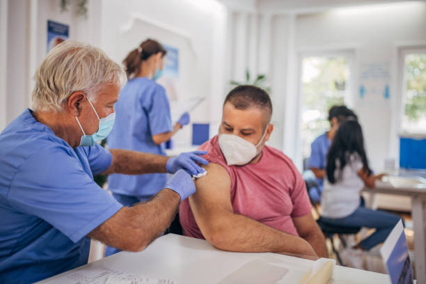 istock Man receiving a vaccine 1335868374