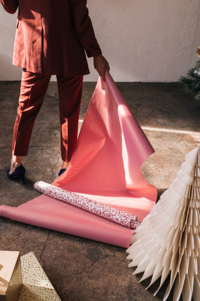 istock An Anonymous Woman Holding Wrapping Papers in her Hands 1335871326