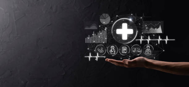 istock Businessman hold virtual plus medical network connection icons. Covid-19 pandemic develop people awareness and spread attention on their healthcare.Doctor,document,medicine,ambulance,patient icon. 1335872603
