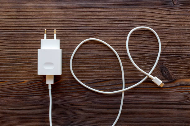 istock Charging cable for mobile phone or laptop, top view 1335873934