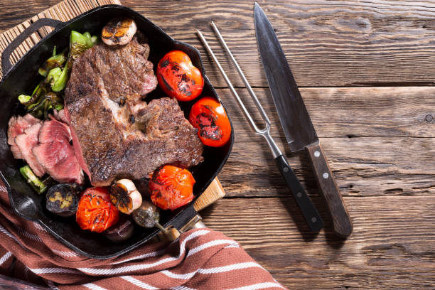 istock A piece of meat grilled in a cast-iron pan with vegetables 1335874079