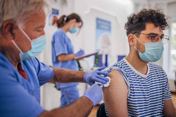 istock Man receiving a vaccine 1335875208