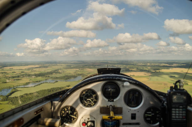istock Motorized glider plane, inside the cockpit in sunny day 1335875831