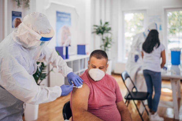 istock Man receiving a vaccine 1335876598