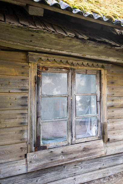 istock Old wooden house with a window, Valdemarpils, Latvia 1335876838
