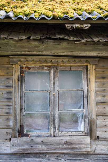istock Old wooden house with a window, Valdemarpils, Latvia 1335876843