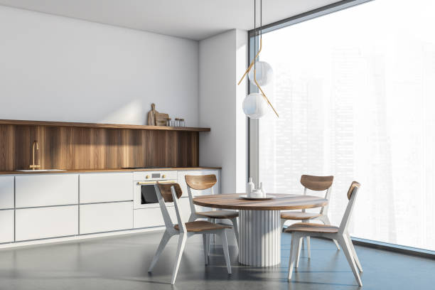 istock White kitchen room corner with panoramic view, wooden furniture 1335879345