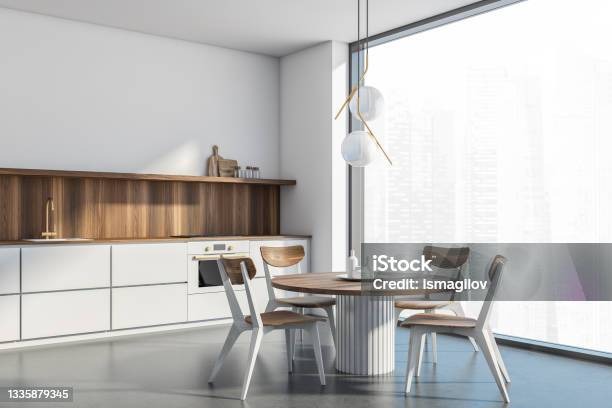 White Kitchen Room Corner With Panoramic View Wooden Furniture Stock Photo - Download Image Now