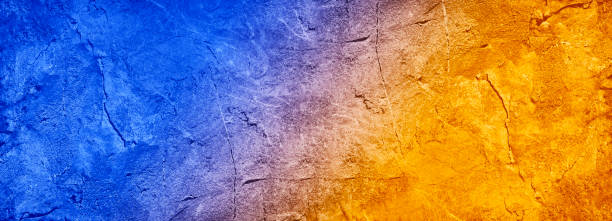 istock Blue orange yellow abstract background. Toned rock texture background with copy space for design. 1335882608