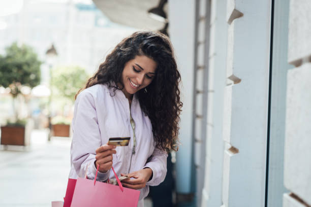 istock Young woman enjoying her shopping day 1335884573