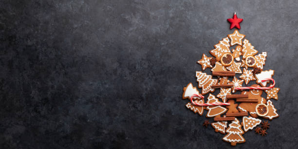 istock Christmas card with fir tree shaped gingerbread cookies 1335885161